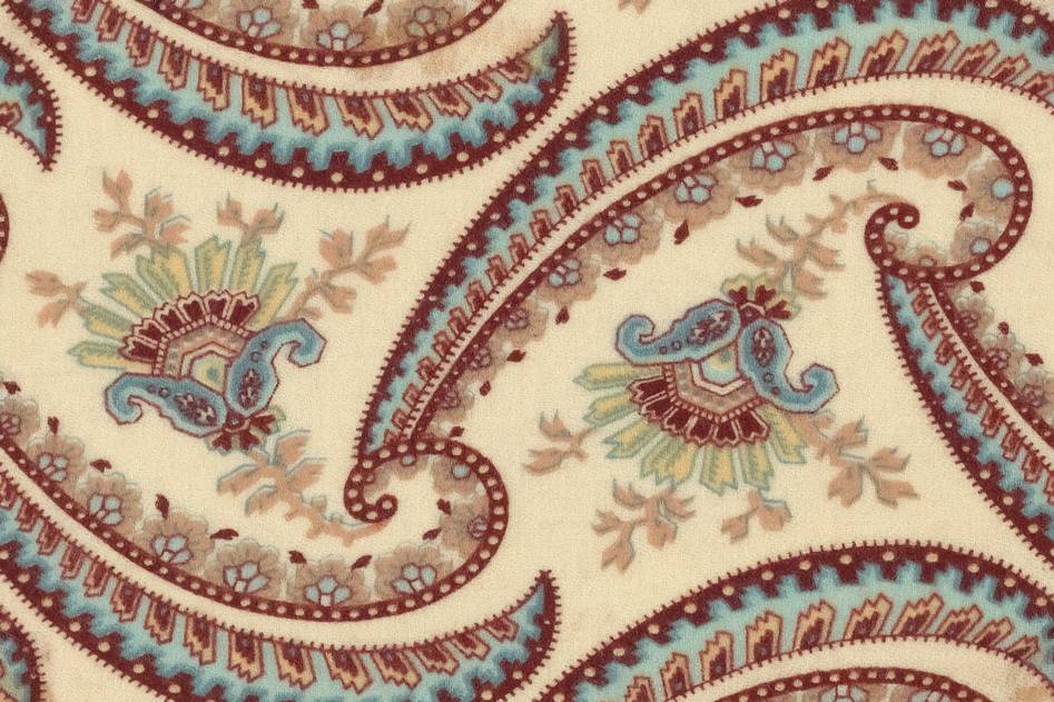 Designer reviewing colorful digital fabric prints in studio